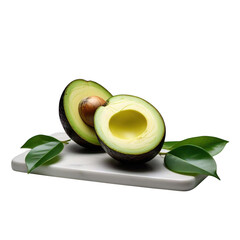 A halved avocado with a pit and leaves on a white marble board against a black background studio shot