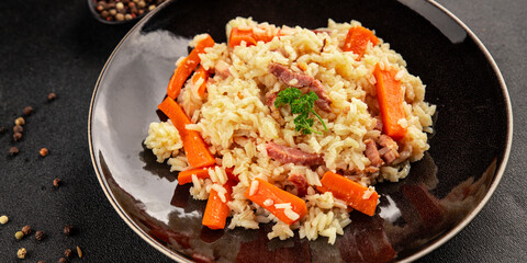 Rice meat and vegetables pilaf fresh delicious gourmet food background on the table rustic food top view copy space