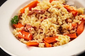 Rice meat and vegetables pilaf fresh delicious gourmet food background on the table rustic food top view copy space