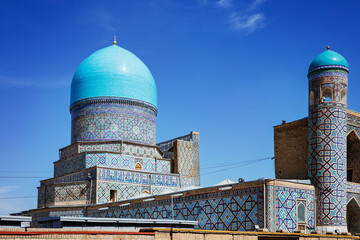 Part of Registan Square in Samarkand, Uzbekistan, a historic architectural ensemble featuring three stunning madrasas. In old arabic God is great on the walls