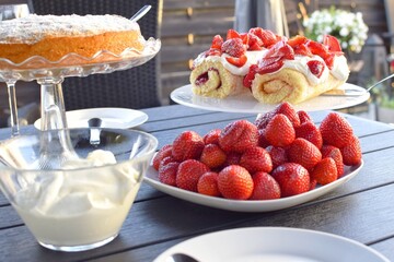 Desserts with strawberries and whipped cream. Swedish fika.