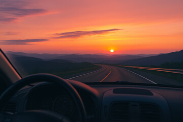 Sunset road view from car with mountain silhouette and colorful sky