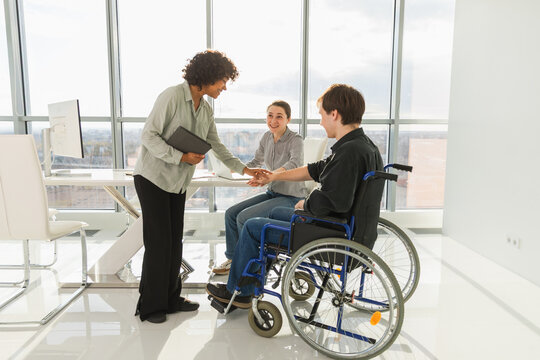 Stack of hands. Business startup teamwork unity concept. Top view of diverse multiracial business people putting hands together. Business colleagues during work process rejoice in success of company