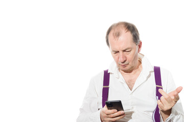 Fototapeta premium Portrait of a sixty-year-old man in a white shirt.