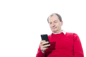 Portrait of a sixty-year-old man in a red pullover.