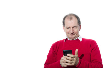 Portrait of a sixty-year-old man in a red pullover.