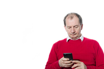 Portrait of a sixty-year-old man in a red pullover.