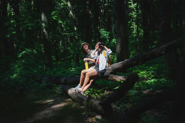 Beautiful young couple relaxing after hiking and taking a break