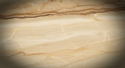 A close up of a light beige and brown marble surface with natural veins and subtle color variations