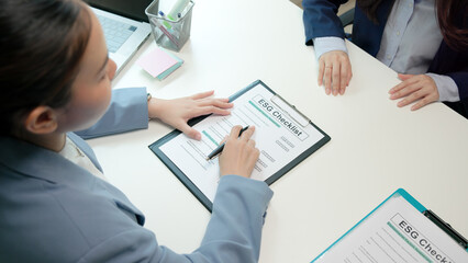 Asian female audit ESG risk check list paper form net zero waste supply chain vendor eco go green...