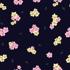 Seamless floral pattern with pink and yellow cherry blossoms on navy blue background for elegant textile and surface design.
