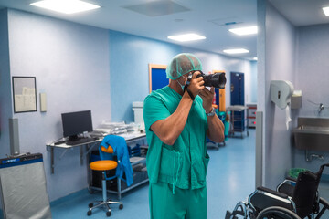 Surgeon taking photos in hospital hallway