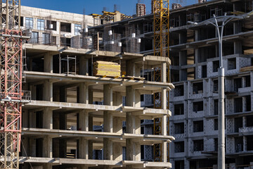 Construction of a multi-storey apartment building. Construction site. Construction in progress and...
