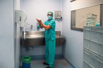 Surgeon washing hands before surgery