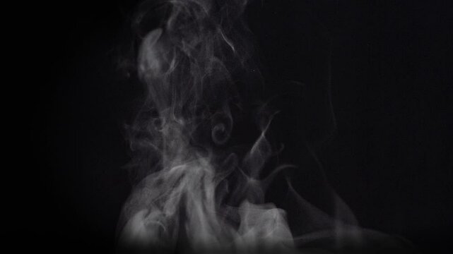 White natural rising steam from food or hot drink isolated on a black background. - Powered by Adobe