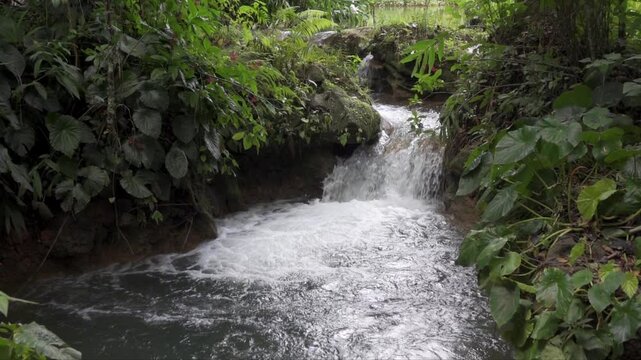 Small waterfall on Hanabanilla river on El Nicho cascade in deep forest Cuba