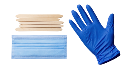 Medical supplies including a face mask, gloves, and wooden sticks on a white isolated background.