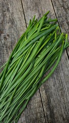 fresh green onions on a wooden table