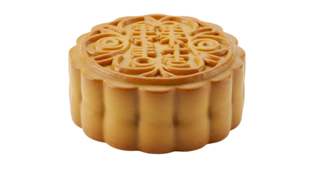 A closeup of a goldenbrown mooncake with Chinese characters and decorative swirls on top set against a black background