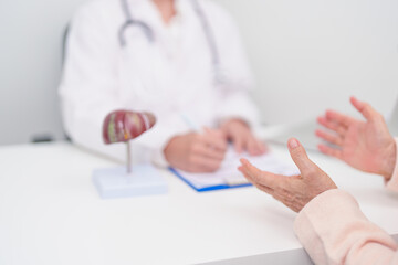 Doctor with human Liver anatomy. Elderly Patient consultation medical health for Liver cancer and Tumor, Jaundice, Viral Hepatitis, Cirrhosis, Failure, Enlarged, Hepatic Encephalopathy, Ascites Fluid