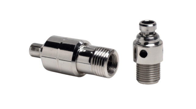 Metal valve fittings on a white isolated background.