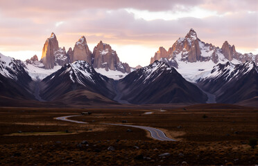 Fototapeta premium Scenery of Snow Mountains, Grassland and Winding Road