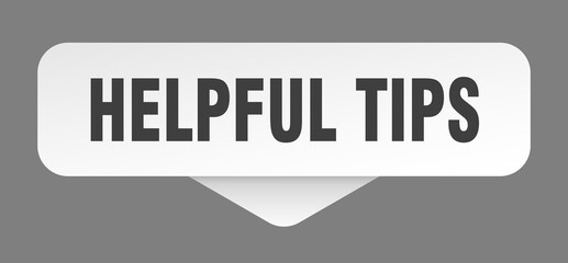 helpful tips sticker. helpful tips sign isolated on gray background