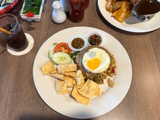 Traditional Malaysian Fried Rice with Egg and Condiments – Local Cuisine Served on a Plate