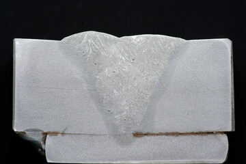 Macroetch weld sample with backing. Etched cross-section shows fusion zone, HAZ, grain structure,...