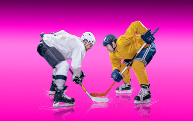 Obraz premium Ice Hockey Players in Action Under Neon Lights. Dynamic pose and intense atmosphere highlight the energy of the sport. Competition, teamwork, modern sports aesthetics.