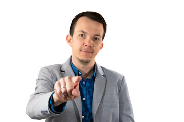 Man in light grey blazer pointing finger toward camera with confident facial expression and direct...