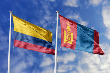 Colombian and Mongolian flags proudly wave together, symbolizing international relations, friendship, and cultural exchange.