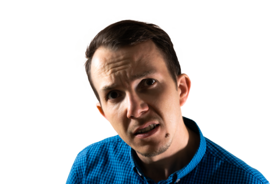 Confused man looking directly at camera with furrowed brow, expressing uncertainty or disbelief often used in reaction or communication visuals. Isolated portrait. Transparent png