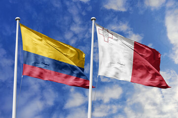 Colombian and Maltese flags proudly wave together, symbolizing international relations, friendship, and cultural exchange.