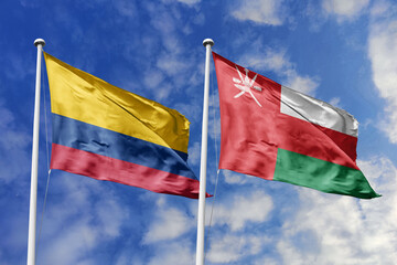 Colombian and Omani flags proudly wave together, symbolizing international relations, friendship, and cultural exchange.