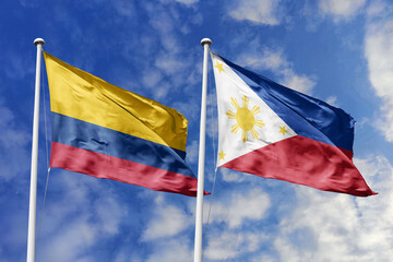 Colombian and Philippines flags proudly wave together, symbolizing international relations, friendship, and cultural exchange.