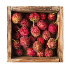 A wooden crate filled with fresh, spiky lychee fruits. The lychees are bright red with green stems, showcasing their unique texture and appearance.