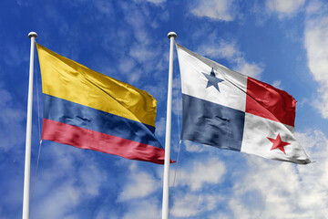 Waving flags of Colombia and Panama against a vibrant blue sky, symbolizing international relations and friendship.