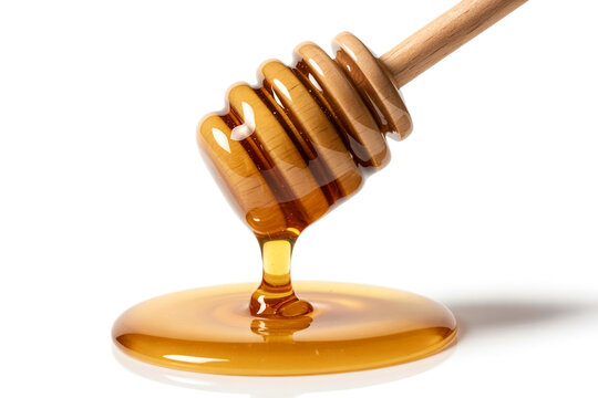 Honey dripping from a wooden dipper isolated on white background