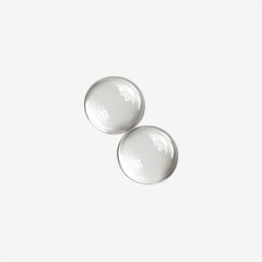 Two clear, round, glossy beads