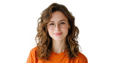 A smiling young woman with curly hair and glasses wearing an orange shirt poses against a plain white background. conveying a cheerful and approachable vibe suitable for lifestyle and fashion conten
