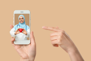Female hands with mobile phone on white background
