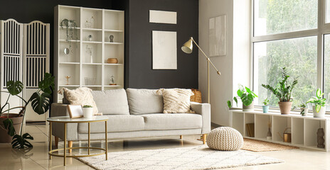 Interior of modern living room with grey sofa and coffee table