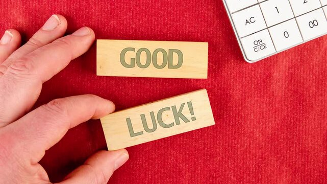 Good Luck symbol. Business and good luck concept. Copy space. ANIMATION of text on wooden blocks
