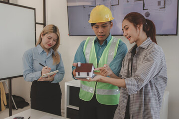 the architect and his team are meeting with the construction supervisor to brainstorm on how to...