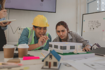 the architect and his team are meeting with the construction supervisor to brainstorm on how to...