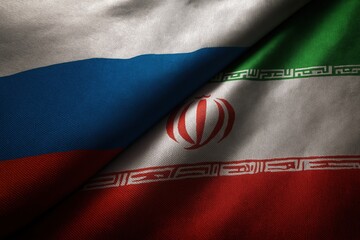 Close-up view of overlapping Russian and Iranian flags showcasing intricate details and national symbolism.