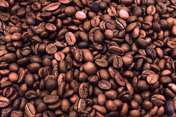 Close close-up of roasted coffee beans background