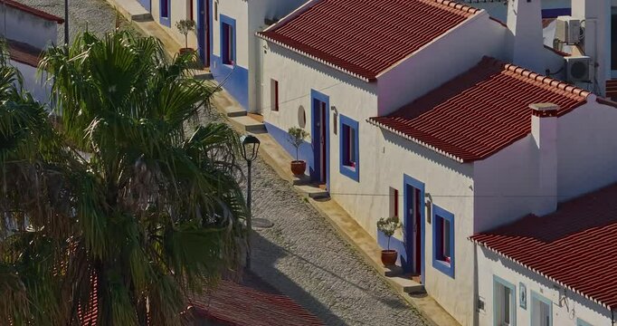 Aerial view of small village with windmill and picturesque rooftops, Odeceixe, Portugal