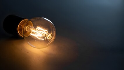 Glowing Lightbulb Idea on Dark Background Representing Innovation and Creativity